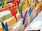 Close up of plastic clothespin on a clotheshorse with drying linen