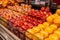 Close up of plastic cup filled with chopped healthy fruit and vegetables in grocery shop. Eco friendly, organic and