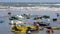 Close up of plastic garbage and trash on the beach. static shot