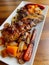 A close-up of a plate of churrasco pork steak