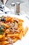 Close-up of plate of pasta and smoked salmon