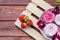 A close up of a plate with toasted meringues topped with berries ready for eating.Handmade marshmallow with strawberries