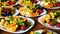 Close-up of plates with different types of fruit and berries on a buffet table.