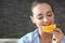 Close up of pleased woman that eating citrus