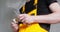 Close-up of plumber hands holding an adjustable wrench and water tap valve. Plumbing work in house.