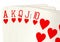 Close up of a poker hand of playing cards showing a royal flush.