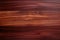 Close-up of a polished, dark red-brown wooden surface with natural grain patterns and knots