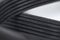 Close-up of a poly V-belt of a generator on a gray background in shallow depth of field. Background for rubber products