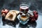 Close up of pomegranate face pack with papaya,grape seed oil and extract or juice on wooden surface in white colored bowl raw pome