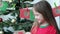 Close up portrait of adorable little girl taking second envelope of Advent Christmas calendar, selective focus