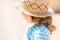 Close-up portrait of adorable little girl at the tropical resort, sunny summer day