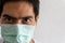 Close-up Portrait of an Asian handsome man adult wearing a protective medical mask