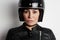 Close-up portrait of attractive biker girl wearing helmet. Horizontal.