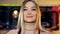 Close-up portrait of an attractive girl waiter in a coffee shop.