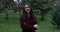 Close up portrait of attractive woman in park. Face of young woman in coat