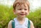 Close up portrait baby boy cheeky smiling face expression