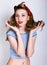 Close-up portrait of a beautiful blond in a striped shirt and red scarf, she supports their hands curly hair. Pin Up