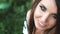 Close-up portrait of a beautiful blue-eyed girl. Girl looks at the camera and smiles