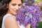 Close up portrait of beautiful bride with big bouquet of lilac