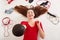 Close up portrait of beautiful happy sportswoman with medball in hands, female surrounded with headphones, skipping rope, fitness