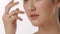 Close up portrait of beautiful young asian woman touching face and healthy skin in slow motion skincare concept.
