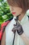 Close-up portrait of beautiful young woman in horsewoman suit in