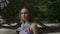 Close up portrait of beautiful young woman walking on tropical beach