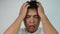 Close up portrait of bored Asian man covering face like facepalm expressing frustration or shame over grey background. Emotion and