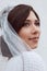 Close-up portrait of bride in white veil. Wedding photo.