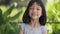 Close-up portrait of the bright face of Asian Thai kid girl aged 6 to 8 years
