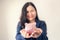 Close Up Portrait of Businesswoman Holding Piggy Bank on Her Hands, Asian Business Woman in Uniform Suit Showing Saving Money