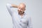 Close up portrait of a casual mature pensive businessman. Studio shot