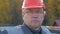 Close Up Portrait Of Caucasian Builder In Helmet And Glasses Looking At Camera