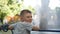 Close up portrait of caucasian teen boy. Funny teenager in summer park at day