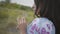 Close-up portrait charming carefree African American girl wearing long summer fashion dress enjoying stands on the field