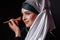 Close-up portrait of charming Muslim woman wearing makeup