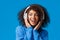 Close-up portrait cheeky and carefree happy smiling african-american modern gen-z girl with afro haircut, curly hair