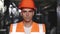 Close up portrait of cheerful foreman builder in safety helmet with face covered in dirt look at camera standing on