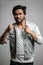 Close up portrait of cheerful indian boxer with clenched fists. ready to box.