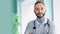 Close-up portrait confident male chief medical officer with beard and white lab coat