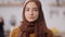 Close-up portrait of confident serious beautiful Middle Eastern woman looking at camera. Headshot of young charming