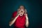 Close up portrait of crazy scared and shocked man isolated on dark background