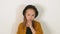 Close-up portrait of cute little fashion girl in the studio against a white wall