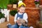 Close up portrait of cute little girl and brown rabbit. Child plays with a rabbit in backyard. Easter celebration. Concept child a