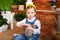 Close up portrait of cute little girl and white rabbit. Child plays with a rabbit in backyard. Easter celebration. Concept child a