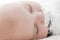 Close up portrait of cute newborn baby sleeping