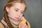 Close up portrait of cute sick girl wearing scarf