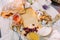 Close-up portrait of delicious food. The composition of cheese, bread, mushrooms, dried fruits, nuts and jar on the