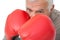 Close-up portrait of a determined senior boxer