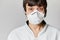 Close up portrait of a Doctor wearing a respirator N95 mask to protect from airborne respiratory diseases such as the flu,